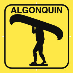 Square yellow sign with black image of person portaging canoe, plus Algonquin lettering, 4 holes for mounting